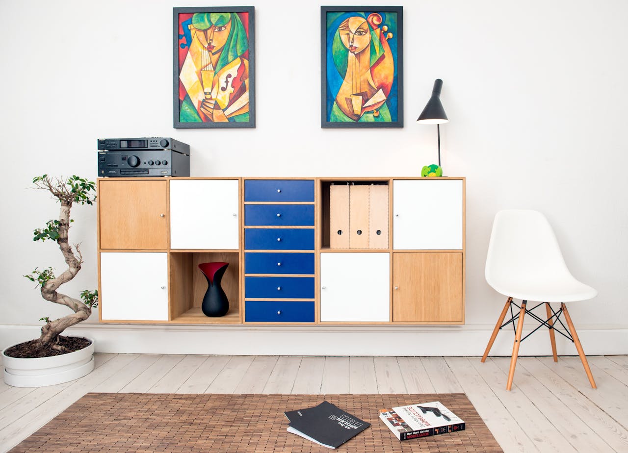 services-01 Contemporary room design featuring colorful artwork, sleek furniture, and decorative elements.